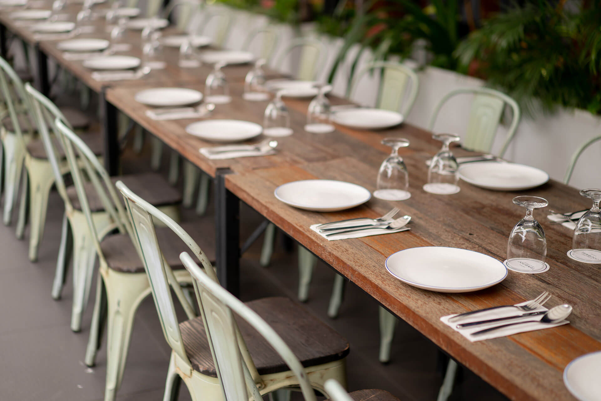Dining table with arranged cutlery Dining table with arranged cutlery at KL Journal Hotel