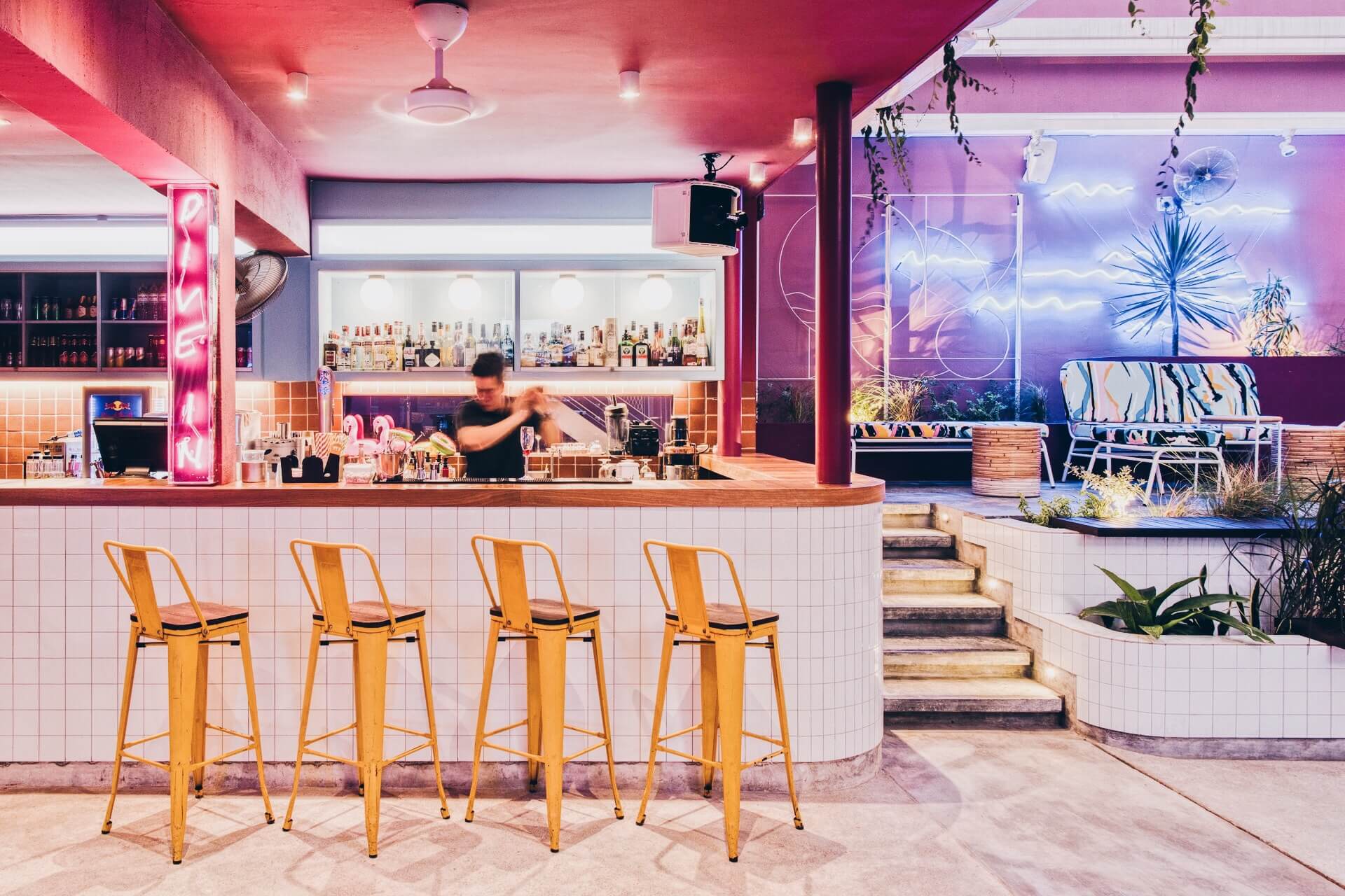 Rooftop bar with neon signs at KL Journal Hotel
