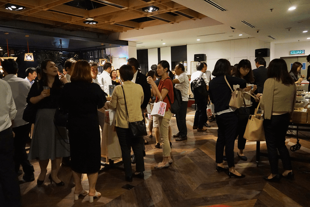 Guests interacting at an event at KL Journal Hotel