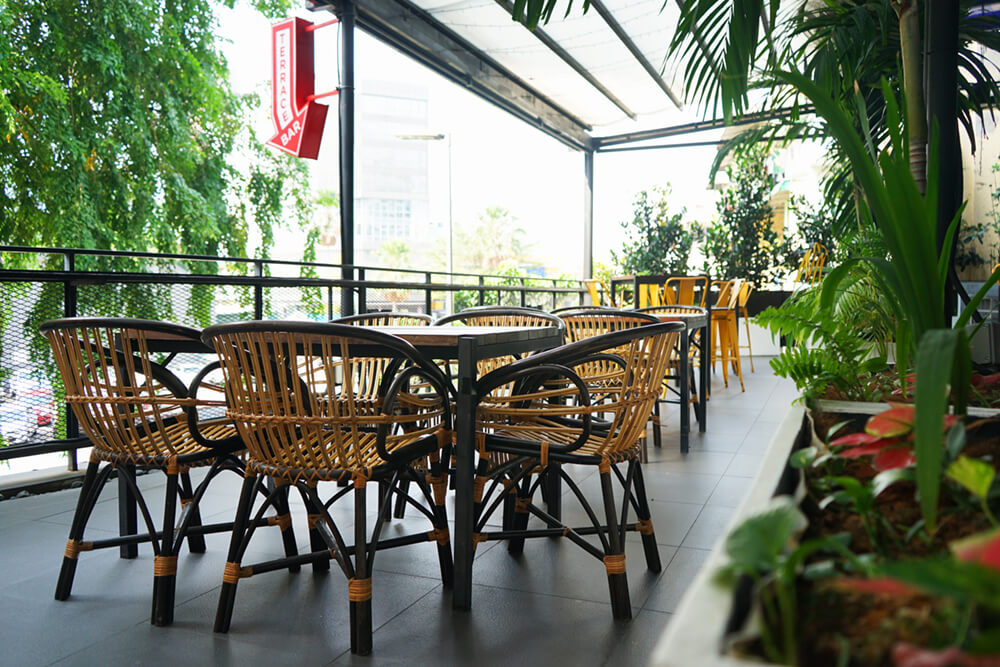 Terrace event space with cane furniture Terrace event space with cane furniture at KL Journal Hotel