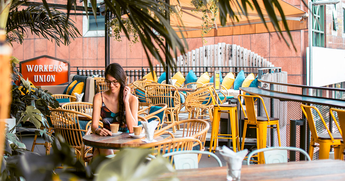 Terrace event space with cane furniture at KL Journal Hotel