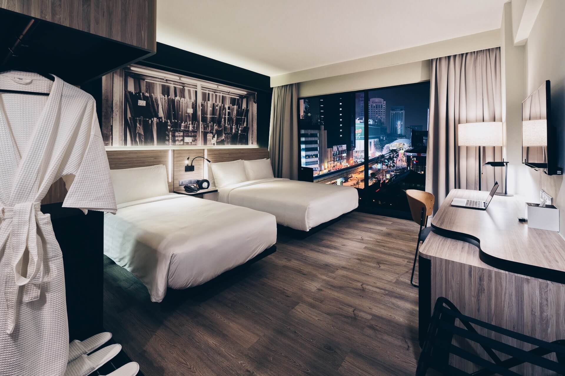 Deluxe Triple room with night city views Deluxe Triple room at KL Journal Hotel with night city views