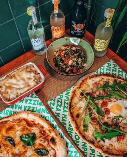 Pizza with side dishes and beverages Pizza with side dishes and beverages